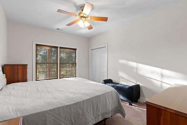 bedroom featuring carpet floors, a closet, and ceiling fan