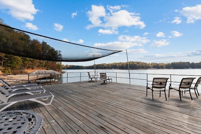 wooden deck with a water view