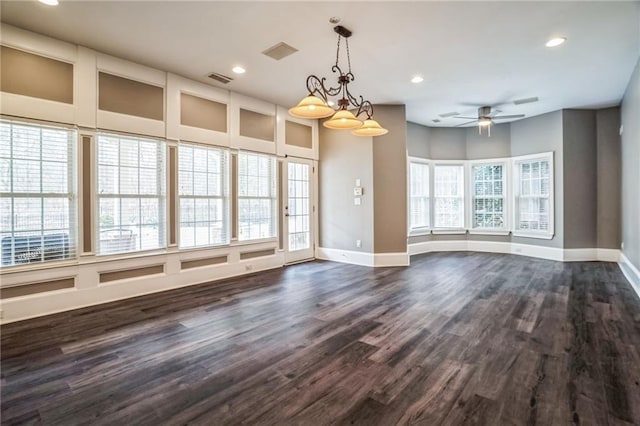 interior space featuring ceiling fan and dark hardwood / wood-style flooring