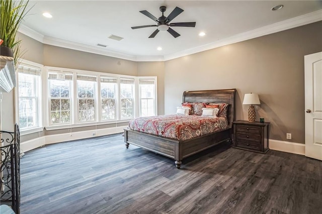 bedroom with crown molding, dark wood-type flooring, and ceiling fan