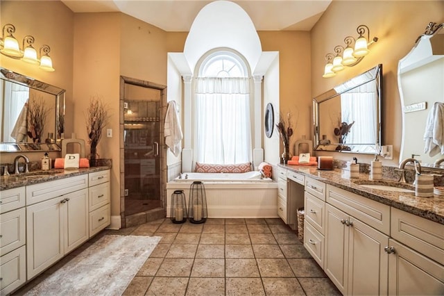 bathroom featuring vanity, independent shower and bath, and tile patterned flooring