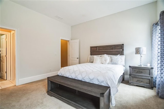 bedroom with light colored carpet