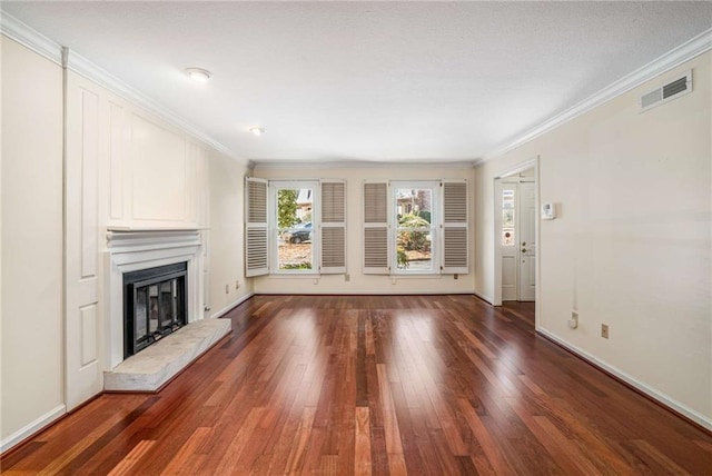 unfurnished living room featuring dark wood-type flooring and crown molding