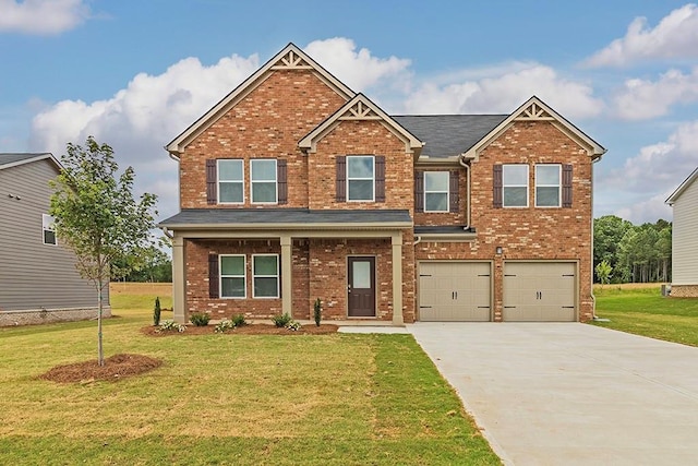 craftsman-style home with a garage, brick siding, concrete driveway, and a front yard