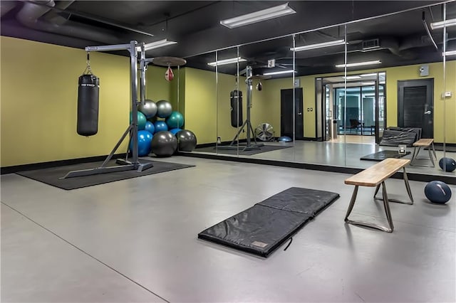 exercise room featuring concrete floors