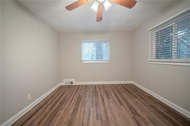 unfurnished room featuring ceiling fan and dark hardwood / wood-style flooring