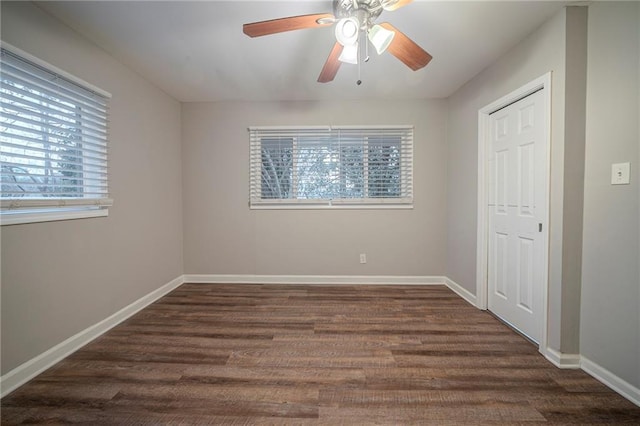 unfurnished bedroom featuring ceiling fan, dark hardwood / wood-style flooring, and a closet