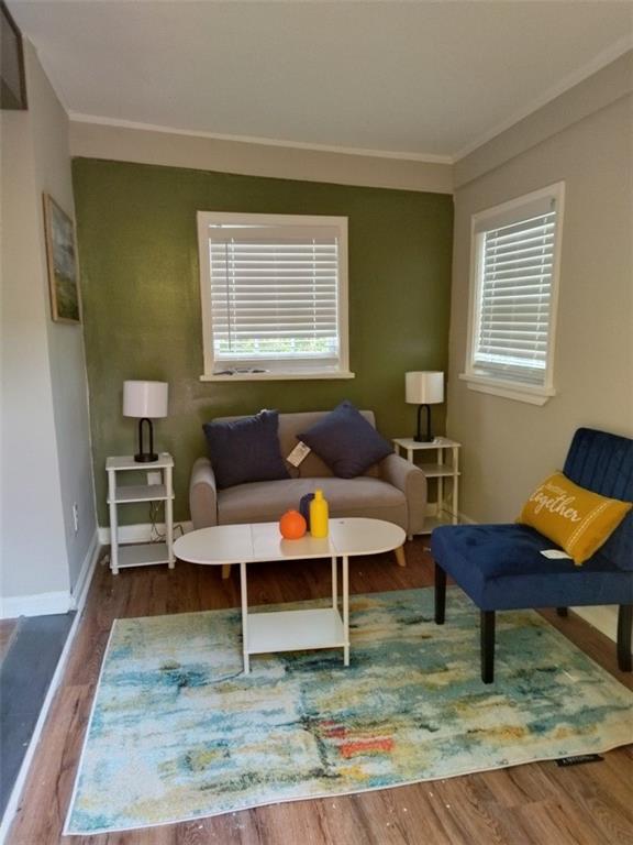 10 Rockmart Dr NW, Atlanta, GA 30314 - sitting room with crown molding, wood finished floors, and baseboards