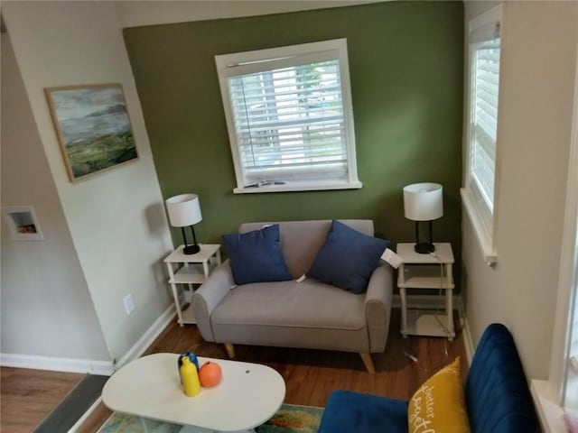 10 Rockmart Dr NW, Atlanta, GA 30314 - living area with plenty of natural light, wood finished floors, and baseboards