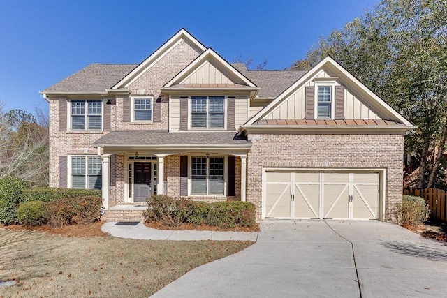 view of front of home with a porch and a garage