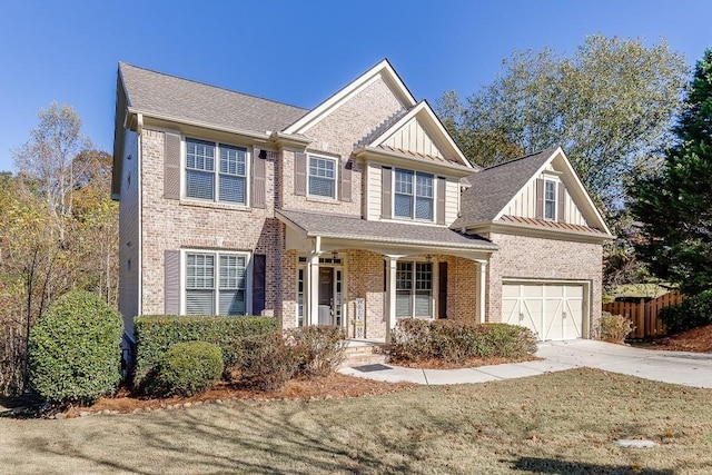 view of front of home featuring a porch and a garage