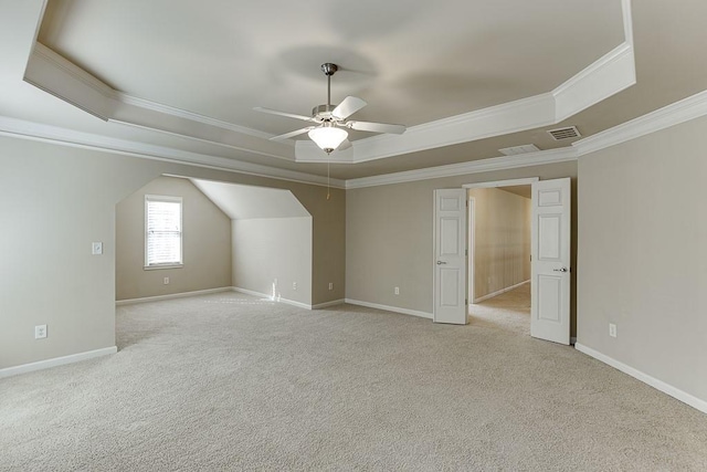 bonus room with light carpet and ceiling fan