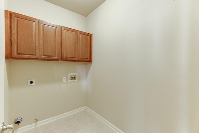 laundry room featuring hookup for an electric dryer, washer hookup, gas dryer hookup, and cabinets