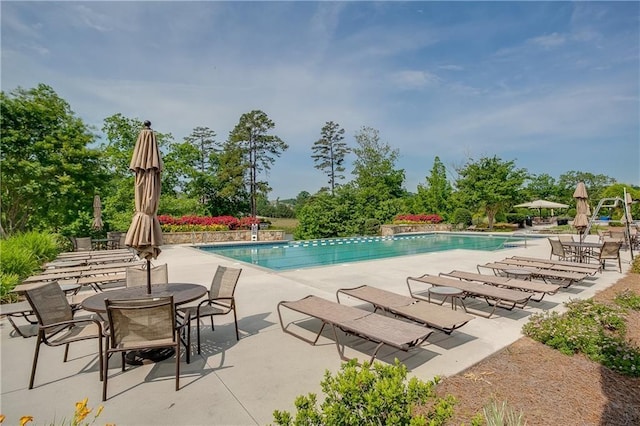 view of pool featuring a patio area