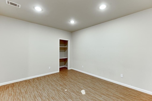 unfurnished room featuring wood-type flooring