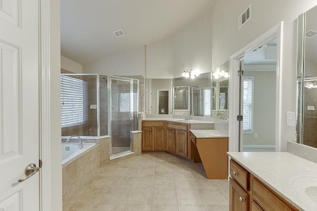 bathroom with tile patterned floors, vanity, and independent shower and bath