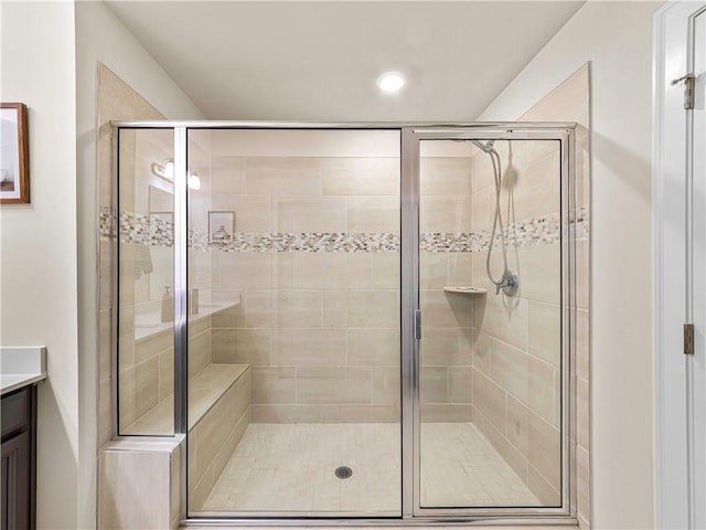 bathroom featuring vanity, recessed lighting, and a shower stall