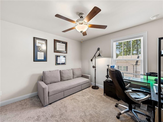 home office featuring carpet floors, baseboards, and ceiling fan