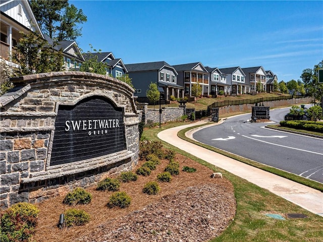 view of street featuring curbs, sidewalks, and a residential view