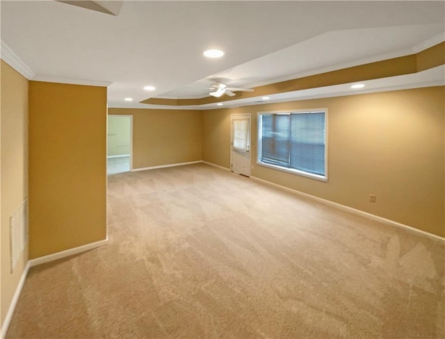 spare room featuring baseboards, ornamental molding, light carpet, and recessed lighting