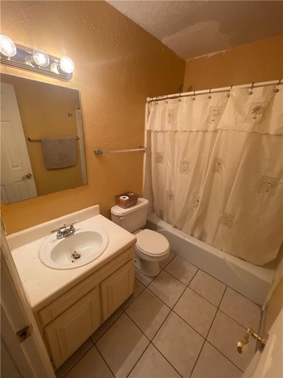 2009 Oak Park Ln, Decatur, GA 30032 - full bathroom with vanity, tile patterned flooring, shower / tub combo, a textured wall, and a textured ceiling