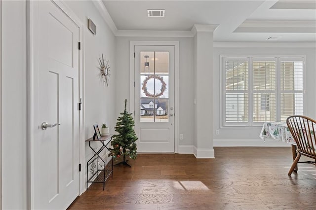 entryway with ornamental molding, a wealth of natural light, and dark wood-type flooring