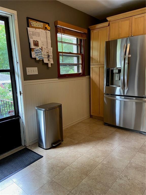 406 S Hillcrest Dr SW, Marietta, GA 30064 - kitchen with stainless steel refrigerator with ice dispenser and a wainscoted wall
