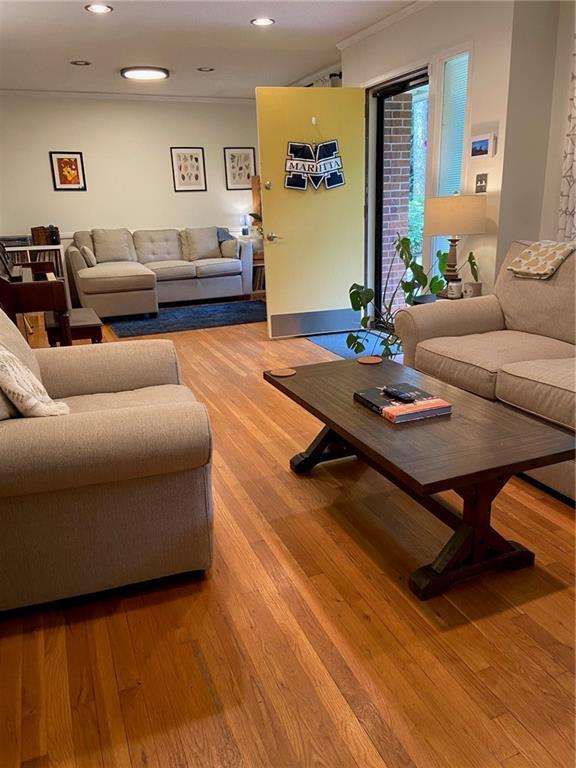 406 S Hillcrest Dr SW, Marietta, GA 30064 - living room with light wood-type flooring, ornamental molding, and recessed lighting