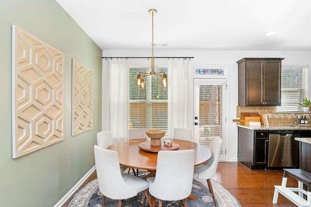 dining area with dark hardwood / wood-style floors