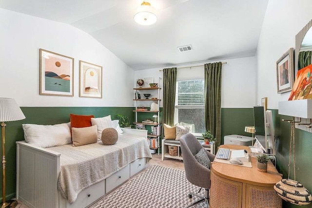 bedroom with lofted ceiling and carpet flooring