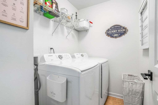 clothes washing area with washing machine and clothes dryer