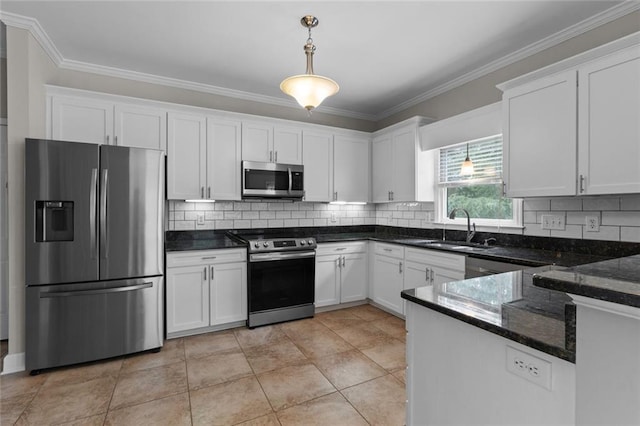 3642 Fowler Rdg, Douglasville, GA 30135 - kitchen with appliances with stainless steel finishes, a sink, pendant lighting, white cabinetry, and ornamental molding
