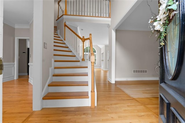 3642 Fowler Rdg, Douglasville, GA 30135 - entrance foyer featuring ornamental molding, stairs, and light wood-style floors