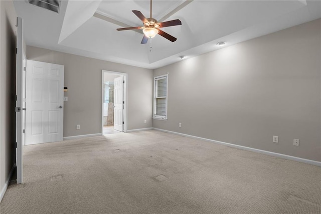 3642 Fowler Rdg, Douglasville, GA 30135 - empty room with a tray ceiling, light carpet, a ceiling fan, and baseboards