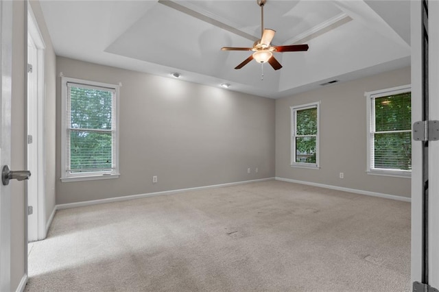 3642 Fowler Rdg, Douglasville, GA 30135 - carpeted empty room featuring a raised ceiling, ceiling fan, plenty of natural light, and baseboards