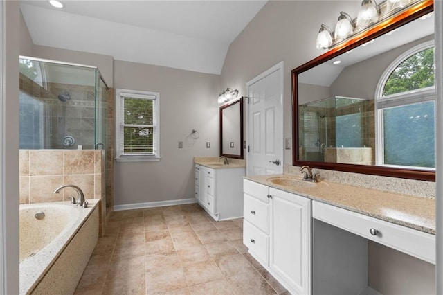 3642 Fowler Rdg, Douglasville, GA 30135 - full bath featuring a shower stall, two vanities, vaulted ceiling, a garden tub, and recessed lighting