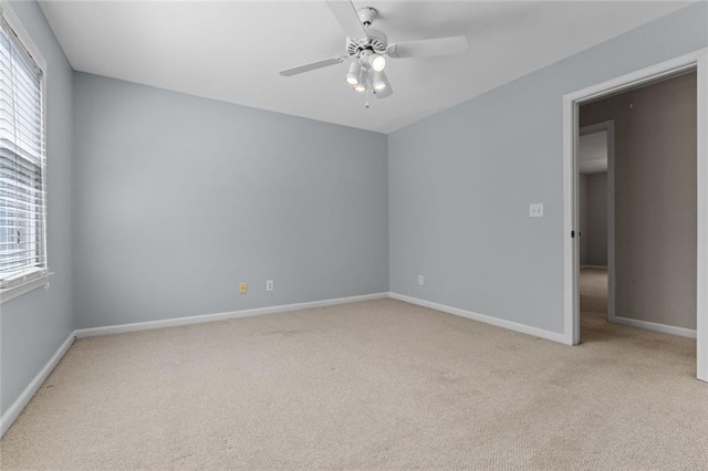 3642 Fowler Rdg, Douglasville, GA 30135 - unfurnished room with light colored carpet, plenty of natural light, a ceiling fan, and baseboards