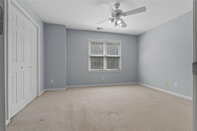 3642 Fowler Rdg, Douglasville, GA 30135 - unfurnished bedroom featuring light colored carpet, a closet, baseboards, and a ceiling fan