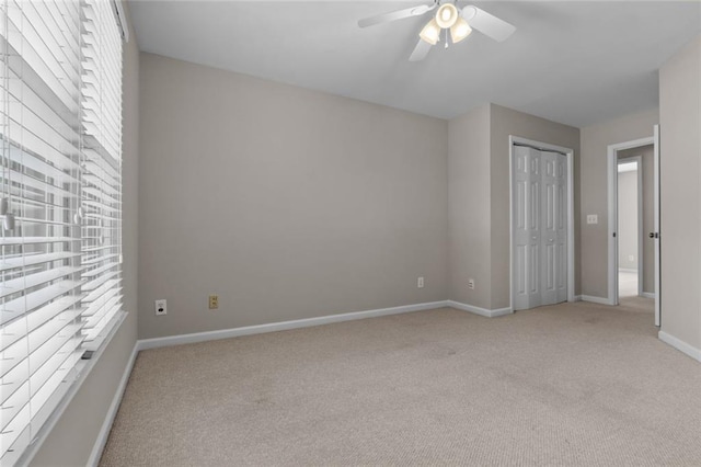 3642 Fowler Rdg, Douglasville, GA 30135 - unfurnished bedroom with light carpet, baseboards, a closet, and a ceiling fan