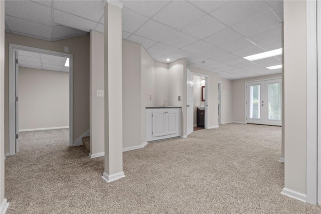 3642 Fowler Rdg, Douglasville, GA 30135 - basement with carpet, a drop ceiling, a sink, baseboards, and stairway