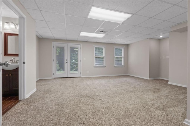 3642 Fowler Rdg, Douglasville, GA 30135 - carpeted empty room featuring a paneled ceiling, a sink, and baseboards