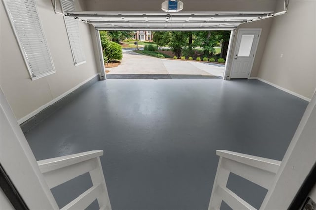 3642 Fowler Rdg, Douglasville, GA 30135 - garage featuring a garage door opener and baseboards