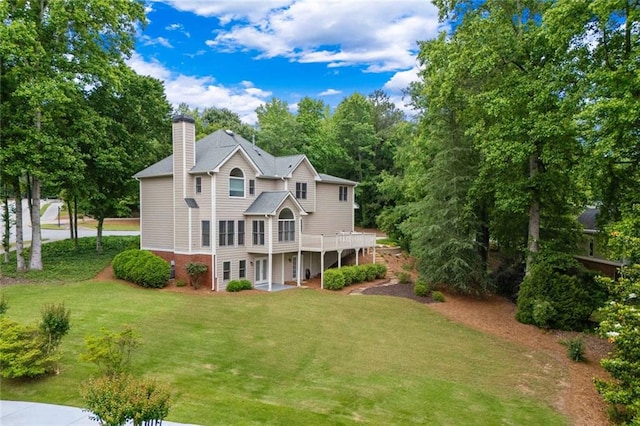 3642 Fowler Rdg, Douglasville, GA 30135 - view of front of home with a chimney, a front yard, and a deck