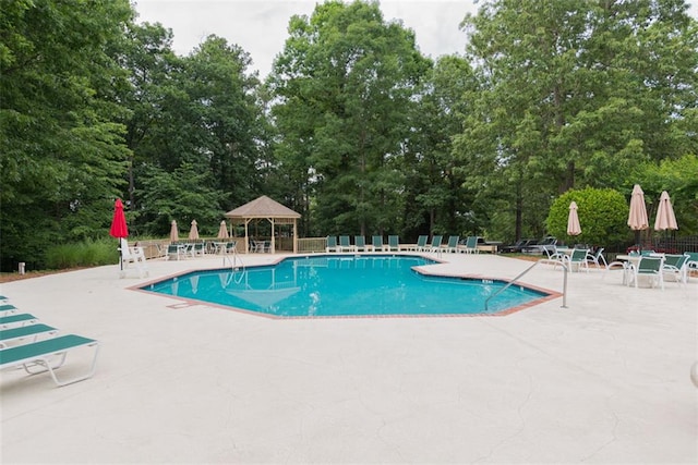 3642 Fowler Rdg, Douglasville, GA 30135 - community pool with a gazebo, a patio, and view of scattered trees