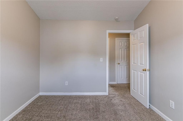 256 Turnstone Rd, Stockbridge, GA 30281 - empty room with carpet floors, a textured ceiling, and baseboards