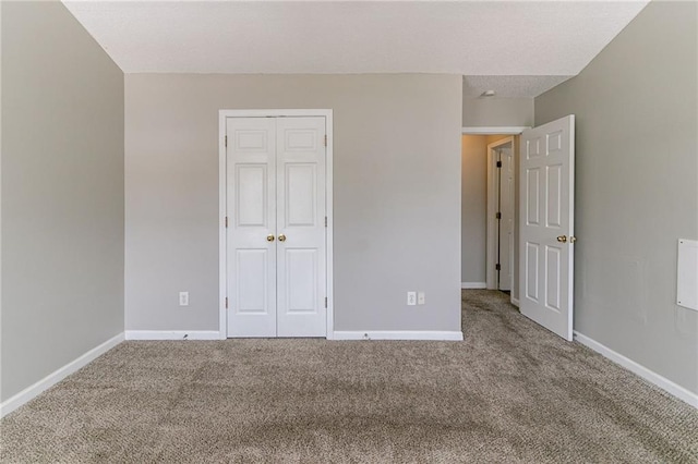 256 Turnstone Rd, Stockbridge, GA 30281 - unfurnished bedroom featuring carpet flooring, a closet, and baseboards