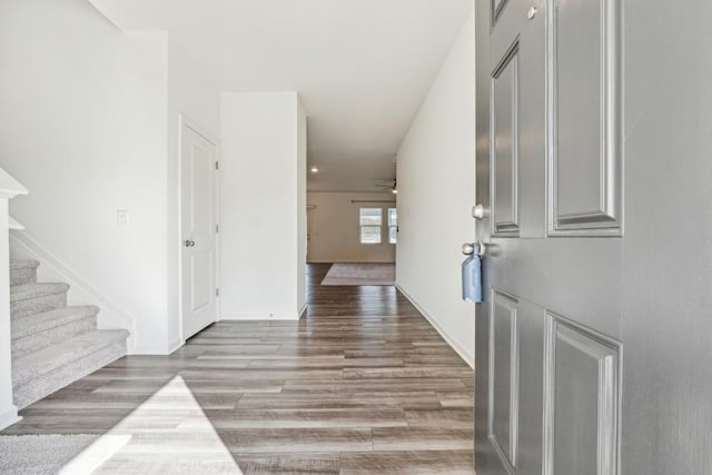 entryway with light wood-type flooring and ceiling fan