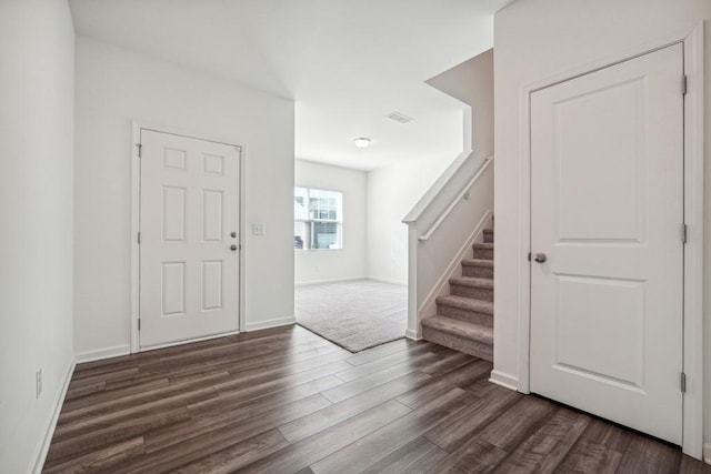 entrance foyer featuring dark hardwood / wood-style floors