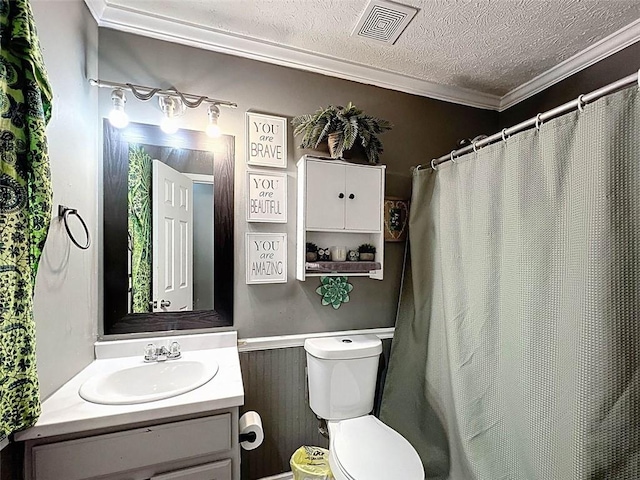 bathroom featuring crown molding, vanity, toilet, a textured ceiling, and visible vents