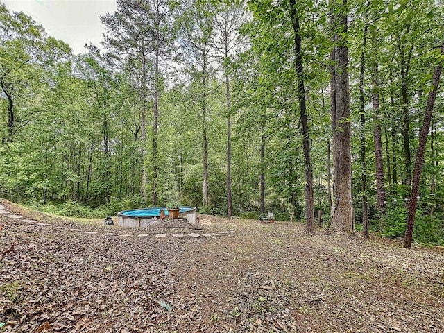 view of yard featuring a view of trees